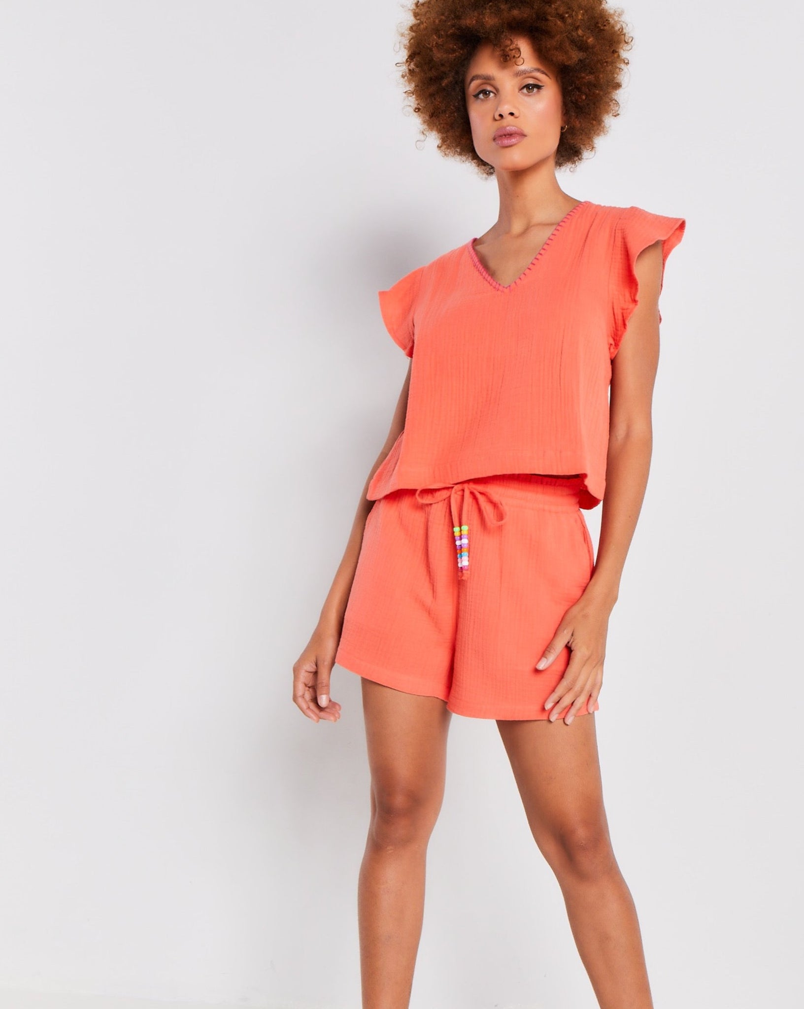 Orange cotton gauze shorts by Lisa Todd.