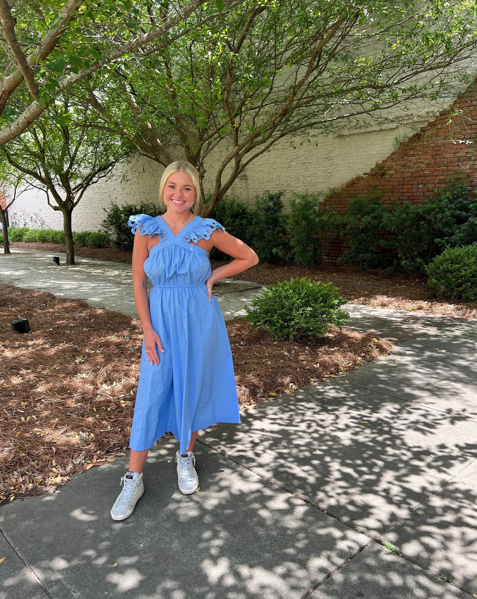 Blue cotton midi with a flutter style halter neckline.