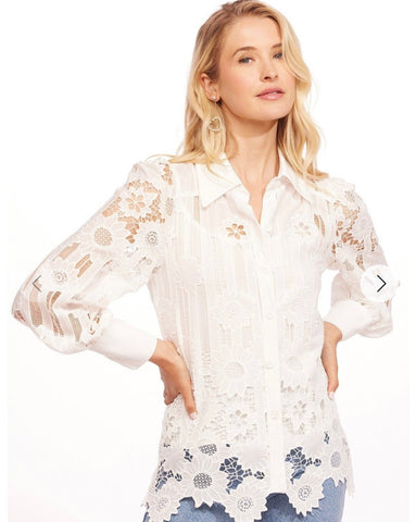 White lace blouse by Eva Franco.
