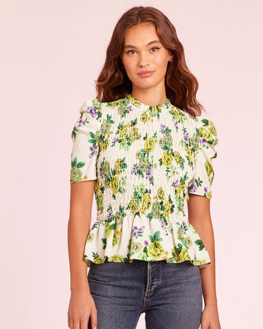 Floral pattern, smocked bodice top. Gathered puff sleeves. This top gives Italian countryside vibes! Amanda Uprichard.