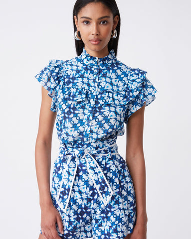 Blue and white cotton top with ruffle detail by Suncoo.